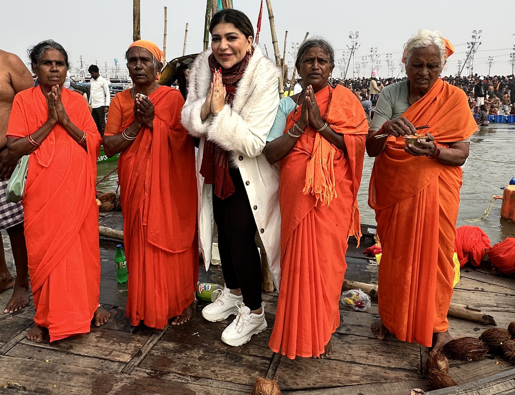 Sally El Azab, Arab expat in Abu Dhabi, poses for a picture with pilgrims at Maha Kumbh Mela in India 