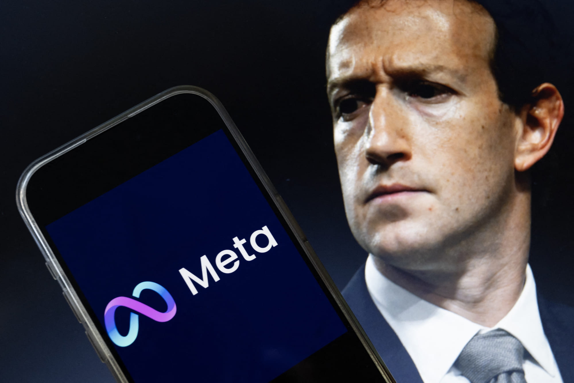 This photo illustration created on January 7, 2025, in Washington, DC, shows an image of Mark Zuckerberg, CEO of Meta, and an image of the Meta logo.