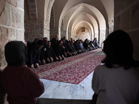 Worshippers pray at Gaza City's historic Omari Mosque on the first day of Ramadan on March 1, 2025. 