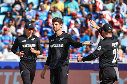 New Zealand's captain Mitchell Santner (C) celebrates with teammates after dismissing India's KL Rahul during the ICC Champions Trophy One-Day International (ODI) cricket match at the Dubai International Stadium in Dubai on March 2.