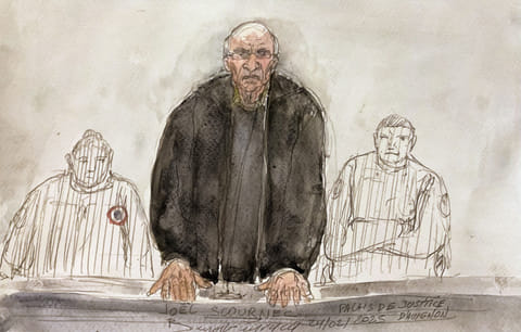 This court sketch created on February 24, 2025 shows retired surgeon Joel Le Scouarnec speaking during a hearing on the opening day of his trial on charges of assaulting or raping 299 patients at the Criminal Court in Vannes. 