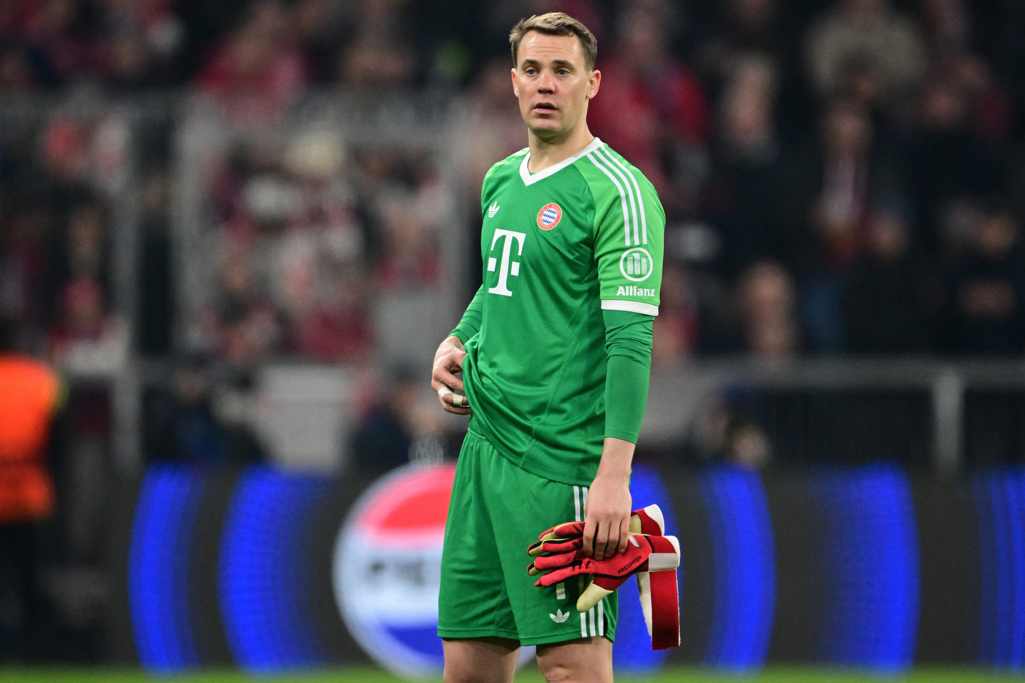 Bayern Munich's German goalkeeper Manuel Neuer goes off after sustaining an injury during the Uefa Champions League last 16, first-leg against Bayer 04 Leverkusen on March 5 in Munich, southern Germany.