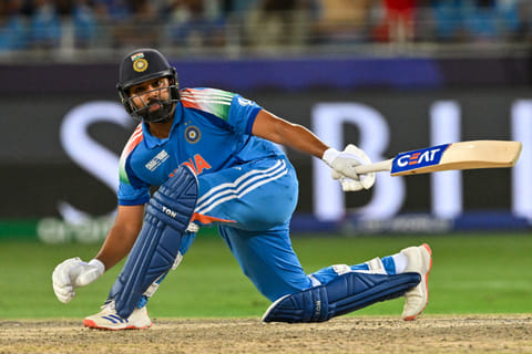 India's captain Rohit Sharma plays a shot during the ICC Champions Trophy one-day international (ODI) final cricket match between India and New Zealand at the Dubai International Stadium in Dubai on March 9, 2025.