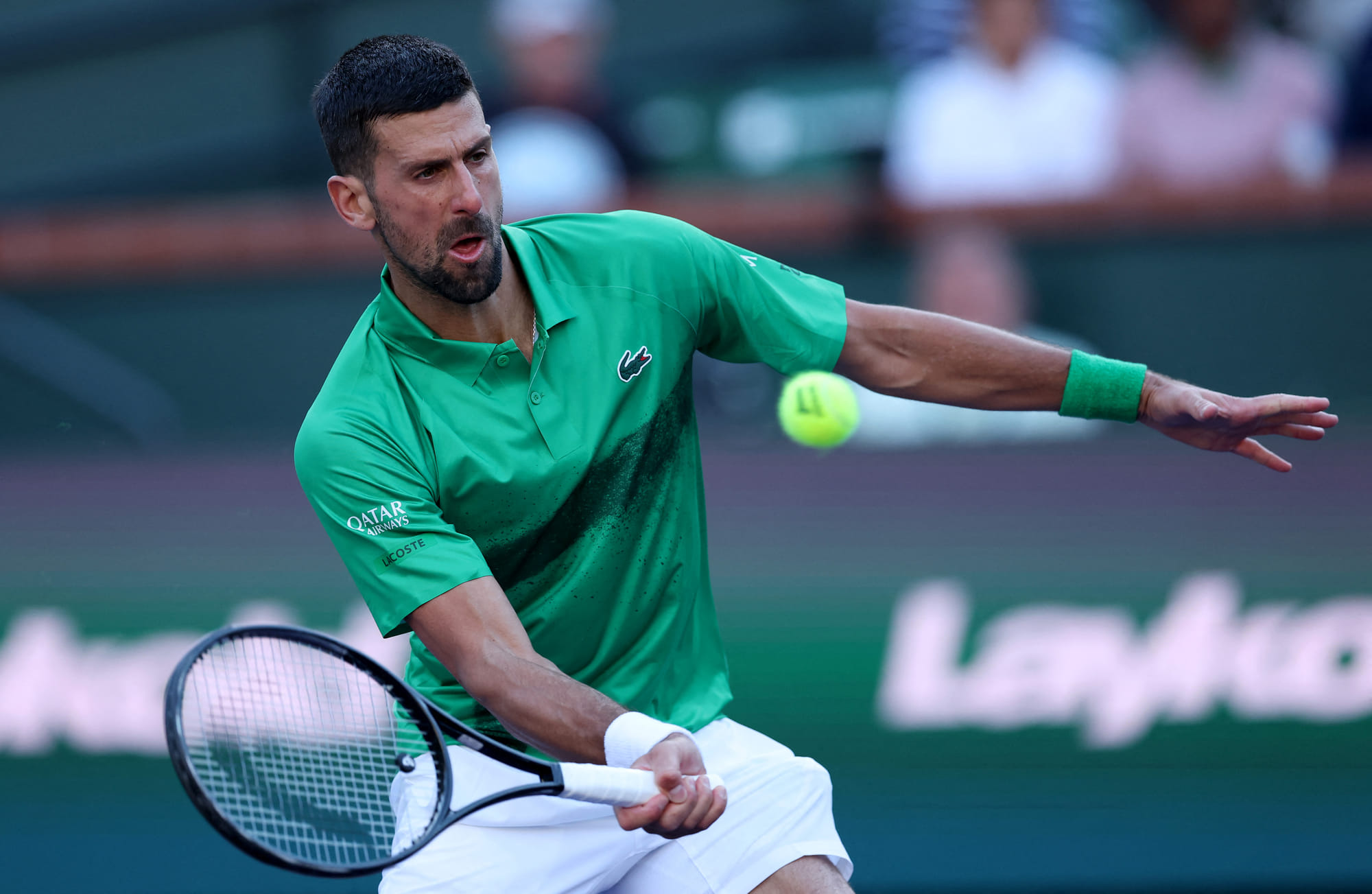 Novak Djokovic of Serbia plays a forehand against Botic van de Zandschulp of the Netherlands during the BNP Paribas Open at Indian Wells Tennis Garden on March 08, 2025 in Indian Wells, California.