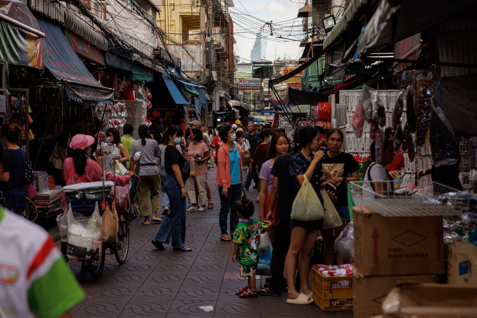 Shoppers at a market in Bangkok. About 2.7 million beneficiaries in the age group will receive 10,000  baht ($295.82) each, with the disbursement set to be made through a new “digital wallet” application meant to boost spending.