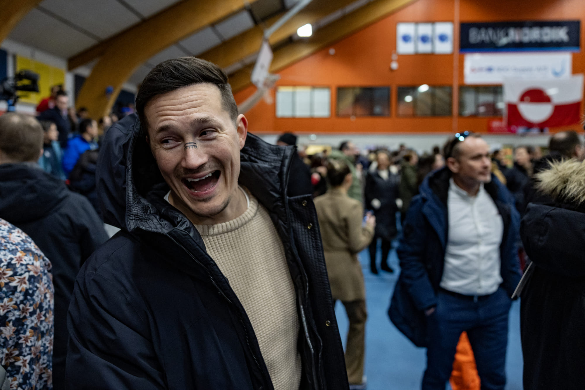 Juno Berthelsen, candidate of the nationalist Naleraq party laughs while queueing to vote at the polling station in Nuuk, Greenland, on March 11, 2025, on the day of Greenland, the autonomous Danish territory legislative elections.