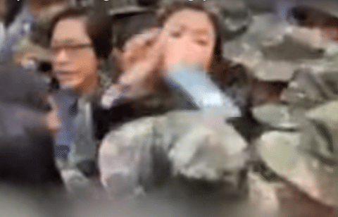 A screengrab shows the moment a cop was allegedly hit in the head by Honeylet Avanceña, common-law wife and partner of Philippine former president Rodrigo Duterte. The video was released by the police on Thursday.