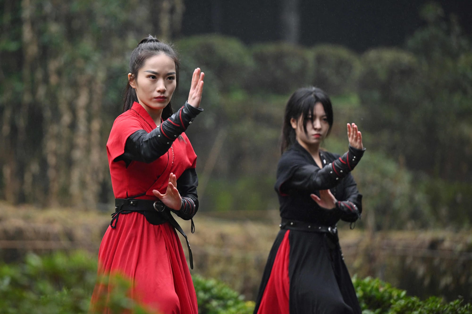 Duan Ruru (L), a founding member of the Emei Kung Fu Girls, and Liu Qiao demonstrate their martial arts movements at the Zhongfei temple in Emeishan, China's southwestern Sichuan province. The ancient Emei school in the mountains of Sichuan is thought to have welcomed a higher proportion of women and girls but has struggled in recent years to raise its profile. That is now changing thanks to a group of women from Generation Z, who mesh skilful swordwork with social media smarts to help put the sect back on the map. 