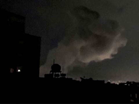 This grab from AFPTV footage shows smoke plumes rising following bombardment on Yemen's Houthi-controlled capital Sanaa on March 15, 2025. 