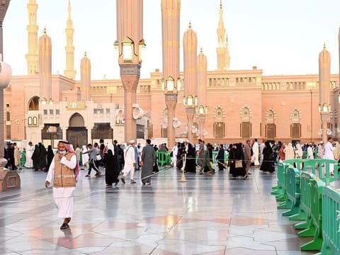Worshippers head to the Prophet's Mosque in Medina. 