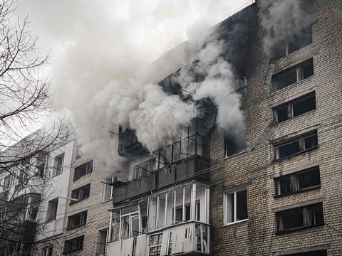 Smoke billows from a residential building following a missile attack in Sumy, northeastern Ukraine, on March 24, 2025, amid the Russian attack of Ukraine. 