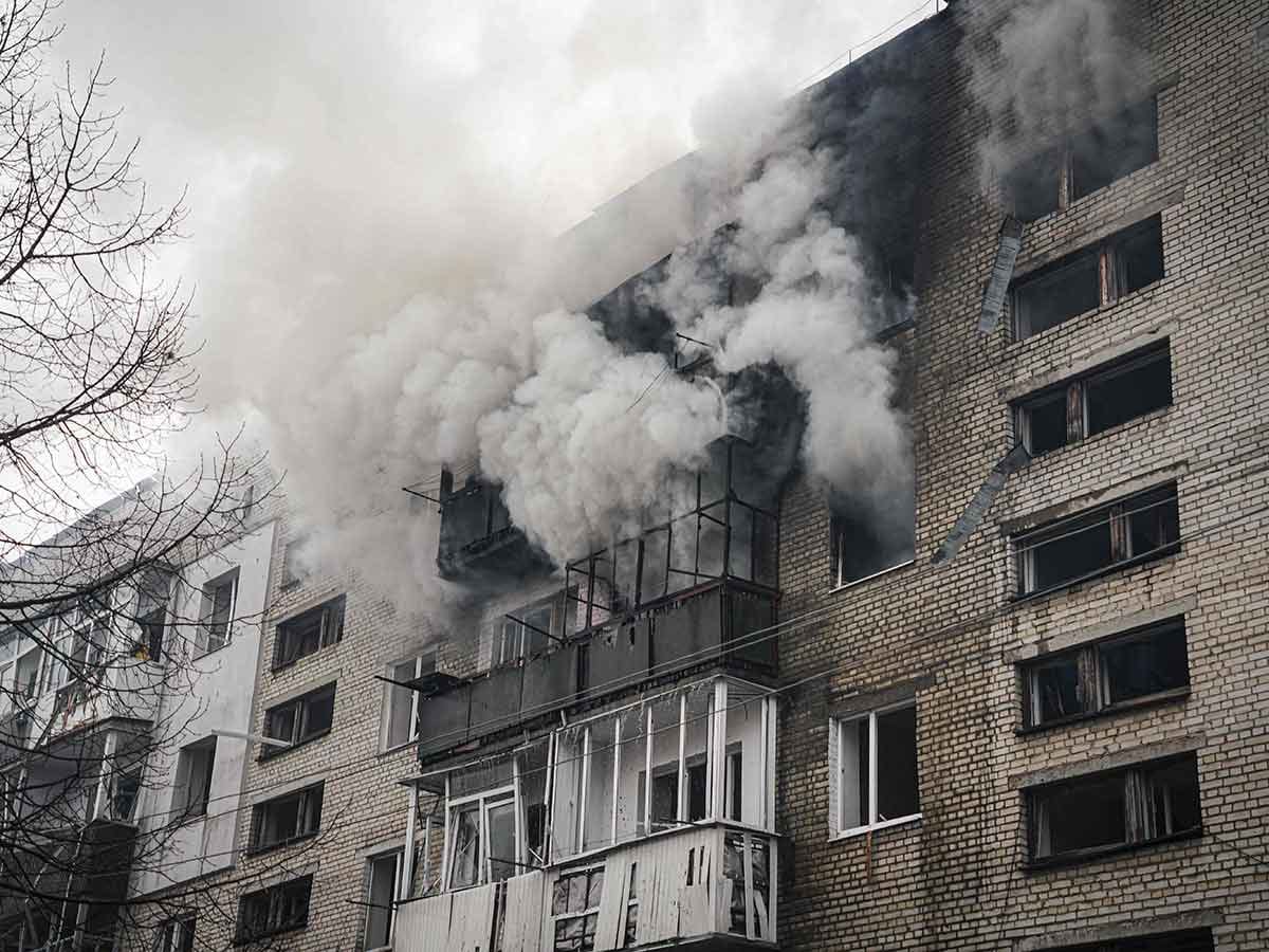 Smoke billows from a residential building following a missile attack in Sumy, northeastern Ukraine, on March 24, 2025, amid the Russian attack of Ukraine. 