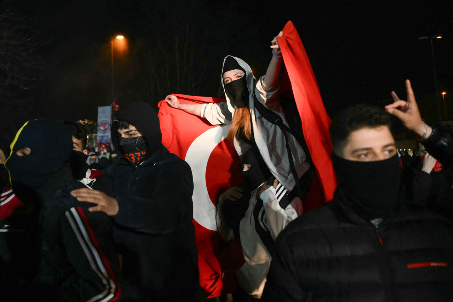 A protester waves a Turkish flag during a rally in support of Istanbul's arrested mayor, in Istanbul, on March 25, 2025. 