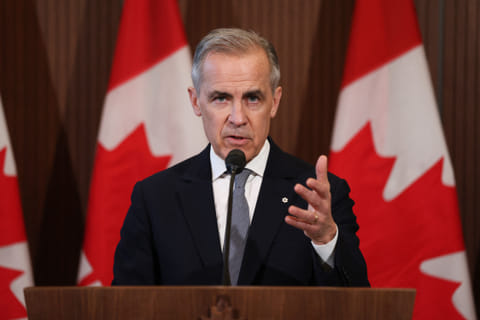Canada's Prime Minister Mark Carney speaks to the media after meeting with his cabinet to deal with the US auto tariffs on Parliament Hill in Ottawa, Canada, on March 27, 2025