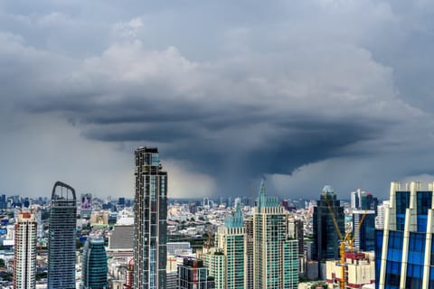 A cumulonimbus cloud is seen over Bangkok's skyline on July 28, 2020.