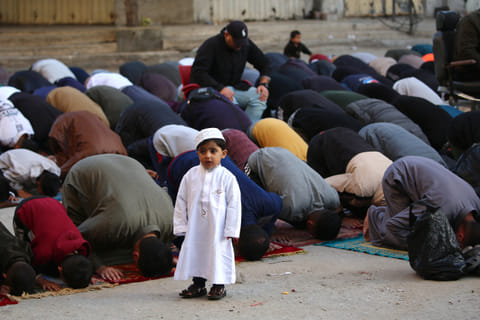 Palestinians attend Eid prayers in the Nuseirat camp for Palestinian refugees in the central Gaza Strip on March 30, 2025.