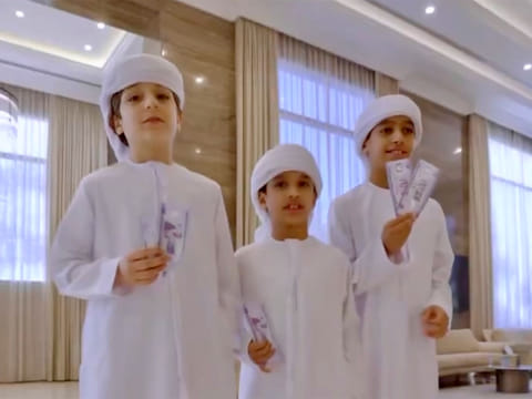 Happy children display the cash gift, traditionally known as Eidiya.