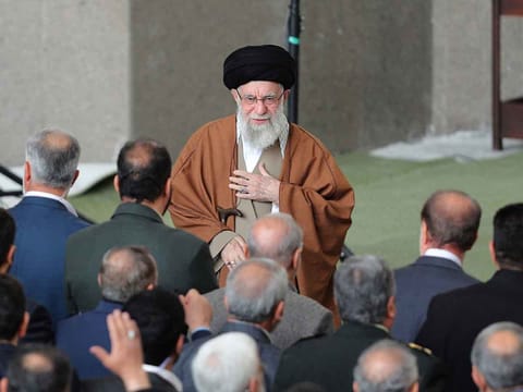 This handout picture provided by the office of Iran's Supreme Leader Ayatollah Ali Khamenei shows him greeting the crowd upon his arrival to lead the morning Eid Al Fitr prayer at the Mosallah in Tehran on March 31, 2025. 