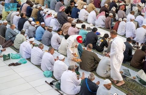 Muslim worshippers break their day-long fast in the Prophet's Mosque in Medina in Ramadan. 