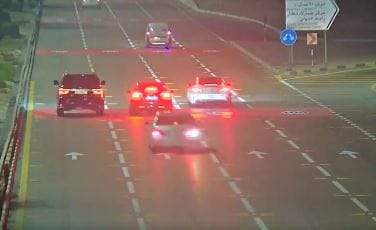 The footage captures a driver recklessly weaving between vehicles at high speed.