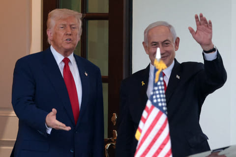US President Donald Trump (L) bids farewell to Israeli Prime Minister Benjamin Netanyahu (R) as he leaves the White House after a meeting on April 07, 2025 in Washington, DC. 