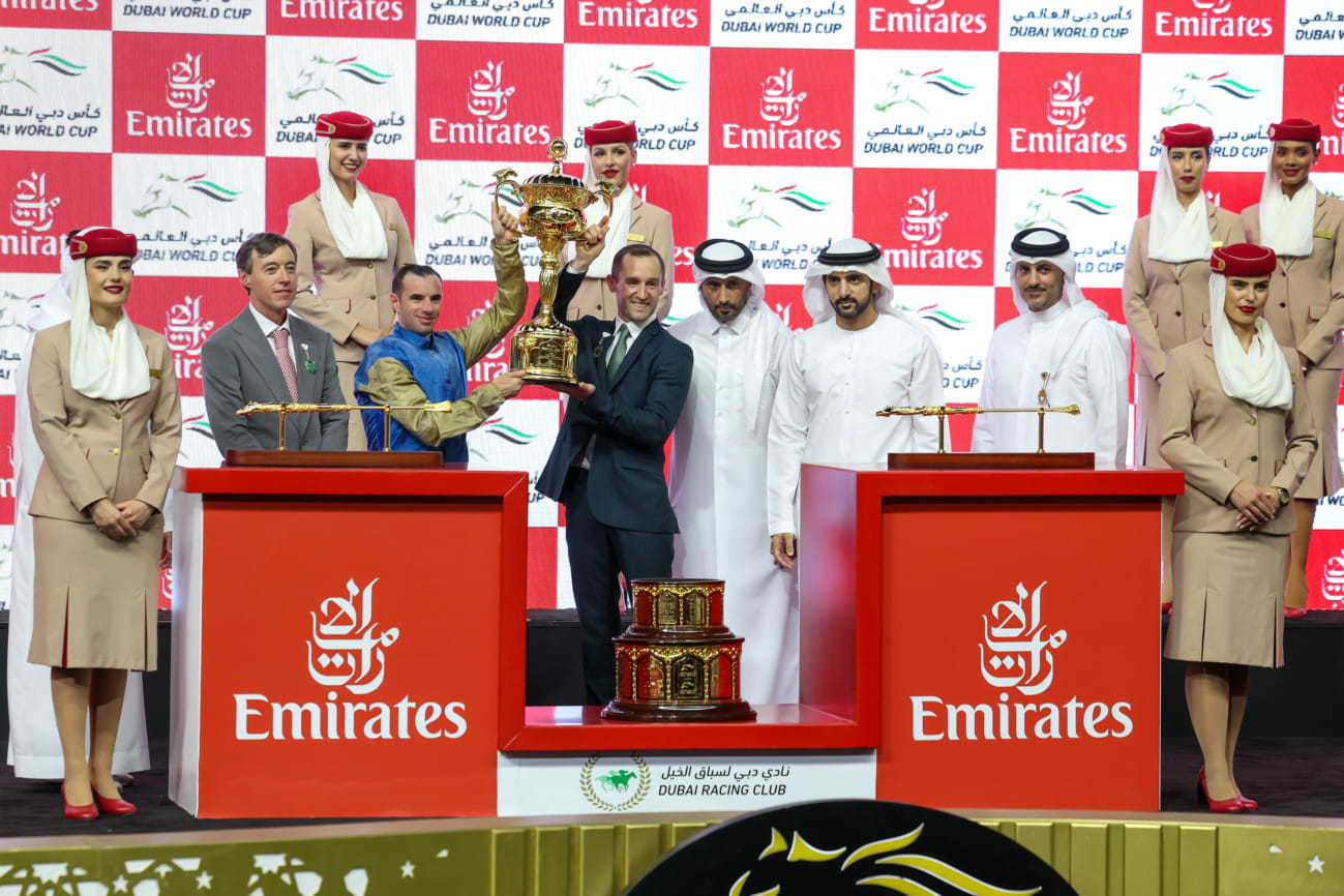 Sheikh Hamdan Bin Mohammed Bin Rashid Al Maktoum, Crown Prince of Dubai, Deputy Prime Minister and Minister of Defence of the UAE, and Chairman of The Executive Council of Dubai, presenting trophy to connections of Hit Show after winning the $12 million Dubai World Cup at Meydan on Saturday night.