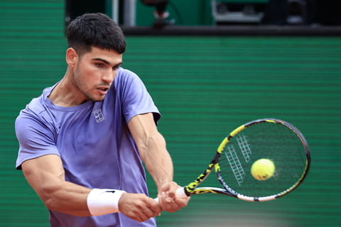 Spain's Carlos Alcaraz plays a backhand return to Argentina's Francisco Cerundolo during the Monte Carlo ATP Masters Series Tournament round of 32 tennis match on the Ranier III court at the Monte Carlo Country Club in Roquebrune-Cap-Martin on April 9.