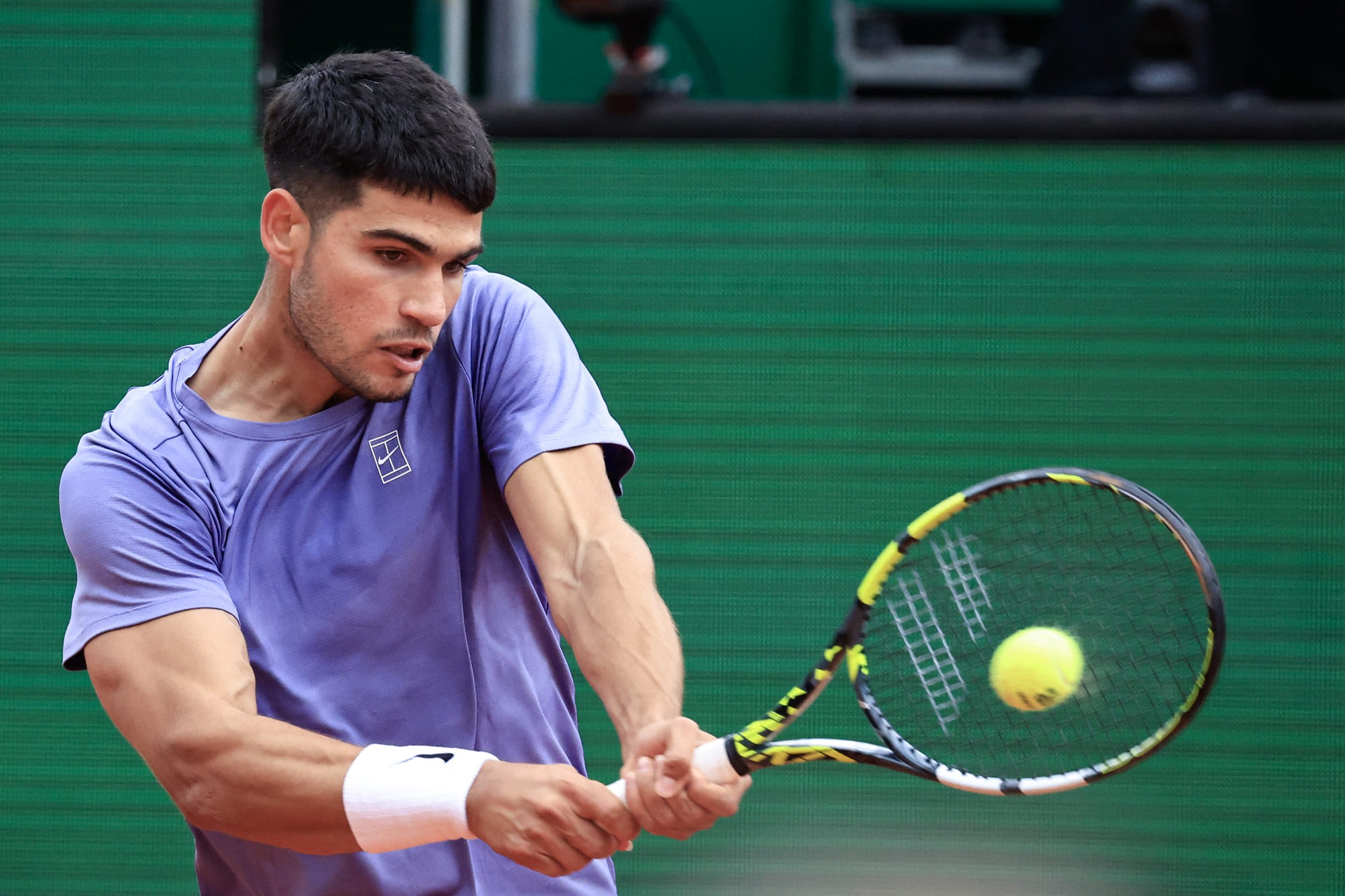 Spain's Carlos Alcaraz plays a backhand return to Argentina's Francisco Cerundolo during the Monte Carlo ATP Masters Series Tournament round of 32 tennis match on the Ranier III court at the Monte Carlo Country Club in Roquebrune-Cap-Martin on April 9.