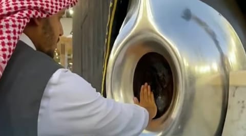 A Saudi official perfumes the Black Stone set into the corner of the Holy Kaaba in the Grand Mosque. 