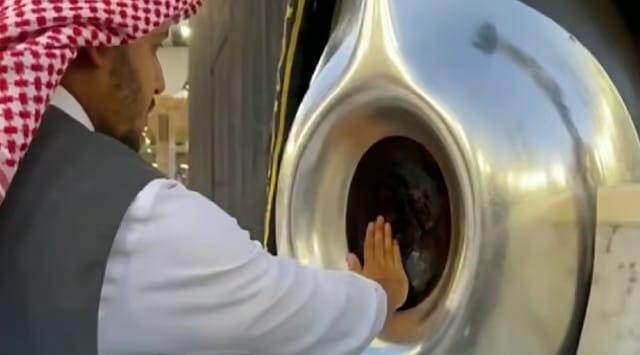A Saudi official perfumes the Black Stone set into the corner of the Holy Kaaba in the Grand Mosque. 
