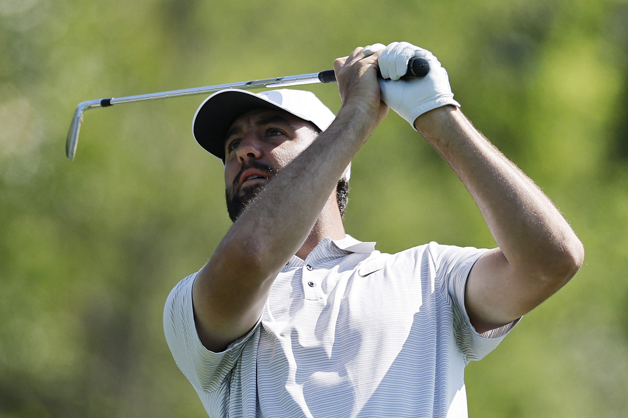Scottie Scheffler of the United States plays his shot from the fourth tee during the first round of the 2025 Masters Tournament at Augusta National Golf Club on April 10 in Augusta, Georgia.