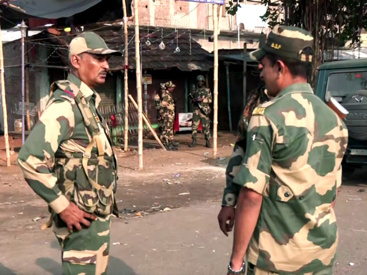 Security personnel stand guard after violent protests against the Waqf (Amendment) Act, at Dhuliyan in Murshidabad on Saturday, April 12, 2025. 