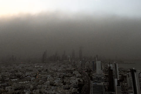 A massive dust storm advances on Kuwait City on April 14, 2025.