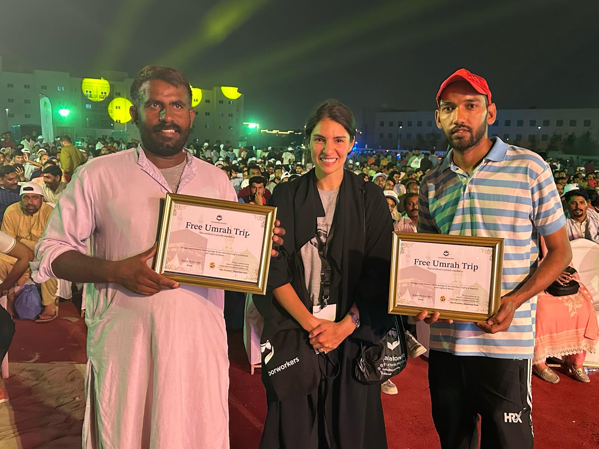 Sophia Sarah Addas presents two free Umrah trips to blue-collar workers during an event in Dubai.
