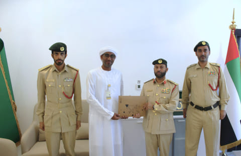 Officers honour Ali Darwish Hassan Ali Al Bloushi at Al Faqaa Dubai Police Station