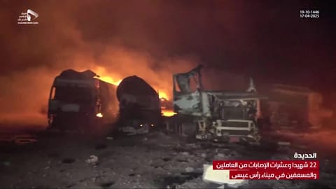 This grab taken from footage released by Al Masirah TV station of Yemen's Houthis shows fire and destruction at the site of US strikes on the Ras Issa fuel port in western Yemen on April 18, 2025.