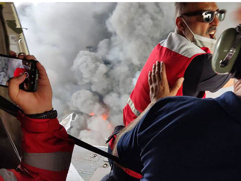 Members of a rescue team arriving by helicopter at the scene of an explosion that took place a day earlier at the Shahid Rajaee port dock southwest of Bandar Abbas in the Iranian province of Hormozgan.  
