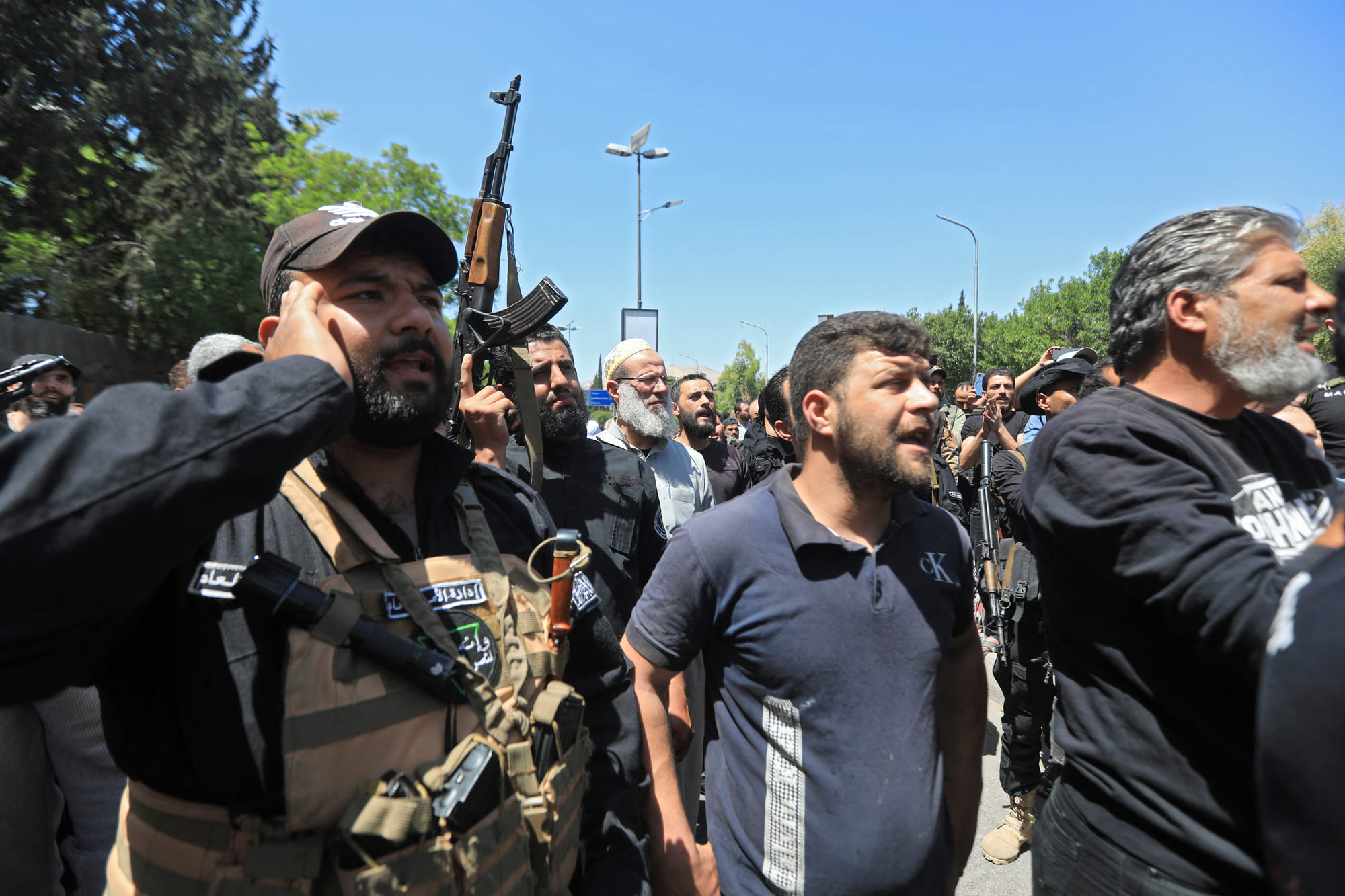 People chant slogans during the funeral of a man in the capital Damascus on April 29, 2025, who was killed during overnight sectarian clashes that left nine people including six Druze fighters dead.