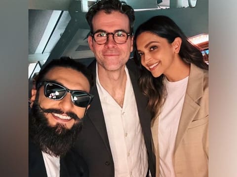 The photo, taken by Ranveer Singh, captures all three smiling warmly at the camera.