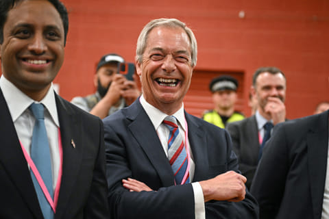 Nigel Farage (C), leader of the Reform UK party, celebrates the victory of Sarah Pochin, the party’s candidate, in the Runcorn & Helsby by-election at the DCBL Stadium in Widnes, north-west England, in the early hours of May 2, 2025.