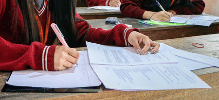 The high-stakes test is being conducted under unprecedented security measures, following last year’s controversy involving alleged paper leaks, inflated scores, and grace mark disputes.