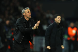 Paris Saint-Germain's Spanish coach Luis Enrique (L) reacts next to Arsenal's Spanish coach Mikel Arteta (R) during the UEFA Champions League semi-final second leg football match, on May 7, 2025.