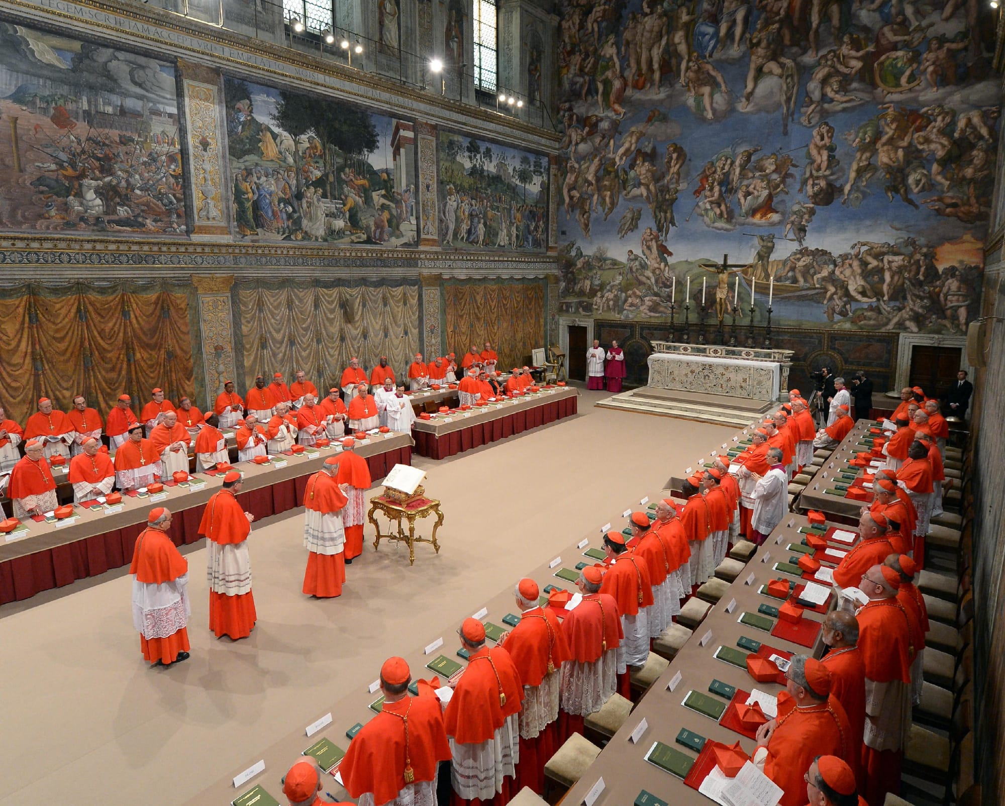 A handout picture released by the Vatican Press office shows cardinals queuing in the Sistine Chapel before the start of the conclave at the Vatican on March 12, 2013.