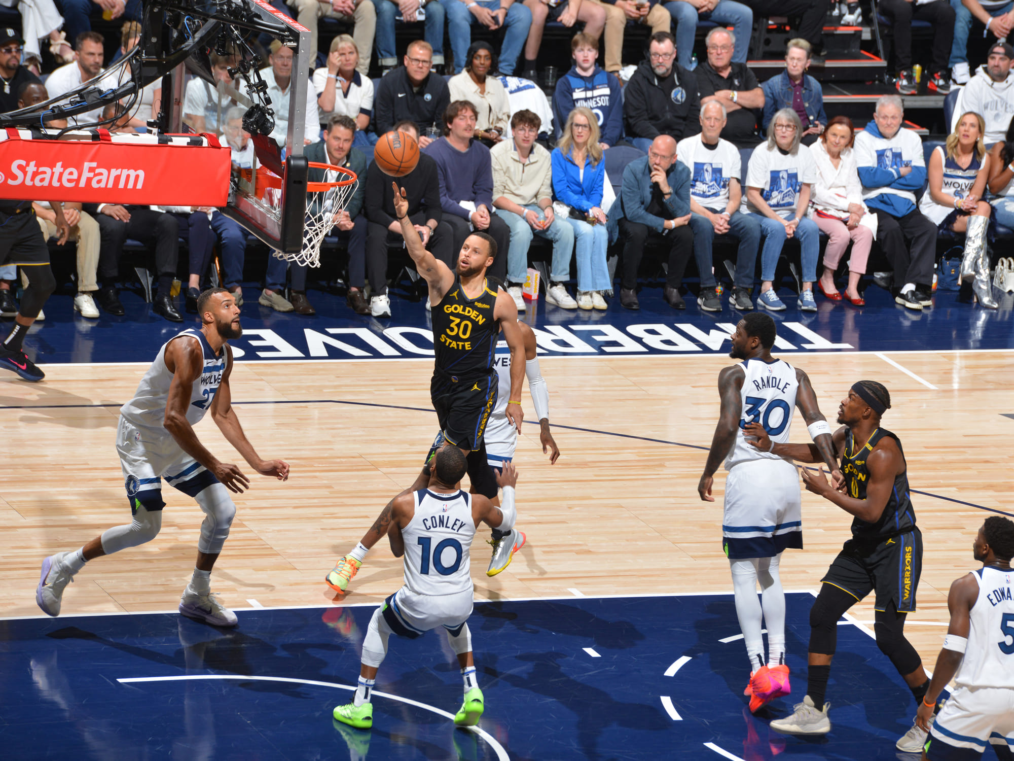 Stephen Curry of the Golden State Warriors drives to the basket during the game against the Minnesota Timberwolves during Round 2 Game 1 of the 2025 NBA Playoffs.