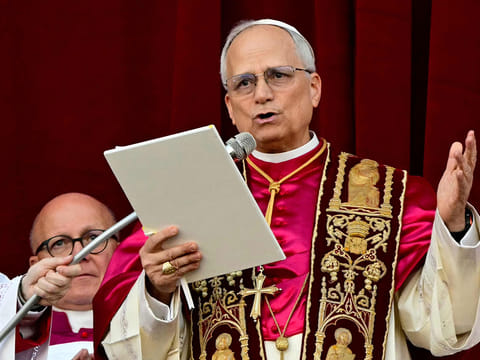 Newly elected Pope Leo XIV, Robert Prevost addresses the crowd from the main central loggia balcony of the St Peter's Basilica for the first time, after the cardinals ended the conclave, in The Vatican, on May 8, 2025.