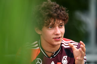 Andrea Kimi Antonelli of Italy and Mercedes AMG Petronas F1 Team looks on in the Paddock.