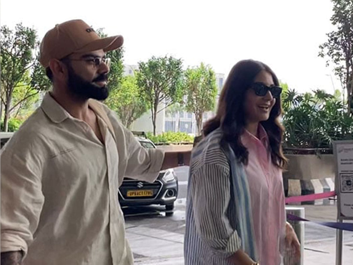 Virat Kohli and Anushka Sharma in a jovial mood as they arrive at Mumbai Airport on Monday.