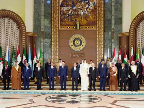 Arab leaders pose for a group photo ahead of the opening session of the 34th Arab League summit in Baghdad on May 17, 2025. 