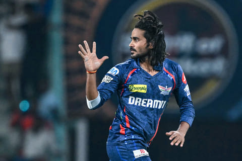 Lucknow Super Giants' Digvesh Rathi celebrates after taking the wicket of Sunrisers Hyderabad's Abhishek Sharma during the Indian Premier League (IPL) Twenty20 cricket match at the Ekana Cricket Stadium in Lucknow on May 19, 2025.
