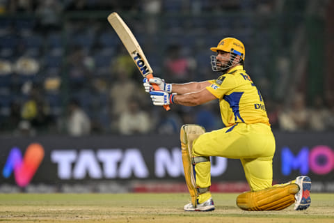 Chennai Super Kings' captain MS Dhoni watches the ball after playing a shot during the Indian Premier League (IPL) Twenty20 cricket match between Chennai Super Kings and Rajasthan Royals at the Arun Jaitley Stadium in New Delhi on May 20, 2025.